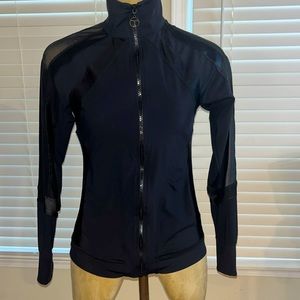 NWOT Women’s Trina Turk athletic jacket with mesh and four leather panels. SMALL